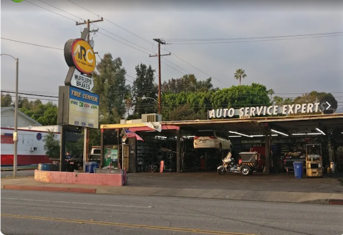 ARC Auto Repair Center shop and sign at dusk